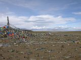 Tibet Kailash 05 To Tirthapuri 02 First View of Lake Manasarovar We circled the prayer flags at the top of this innocent pass (4700m) with holy Lake Manasarovar at our feet, just 6km before Hor Qu. Alas, Kailash and Gurla Mandhata still remained hidden from view.